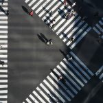 People crossing multiple zebra crossings, representing organisations choosing different paths after VMware licensing changes.