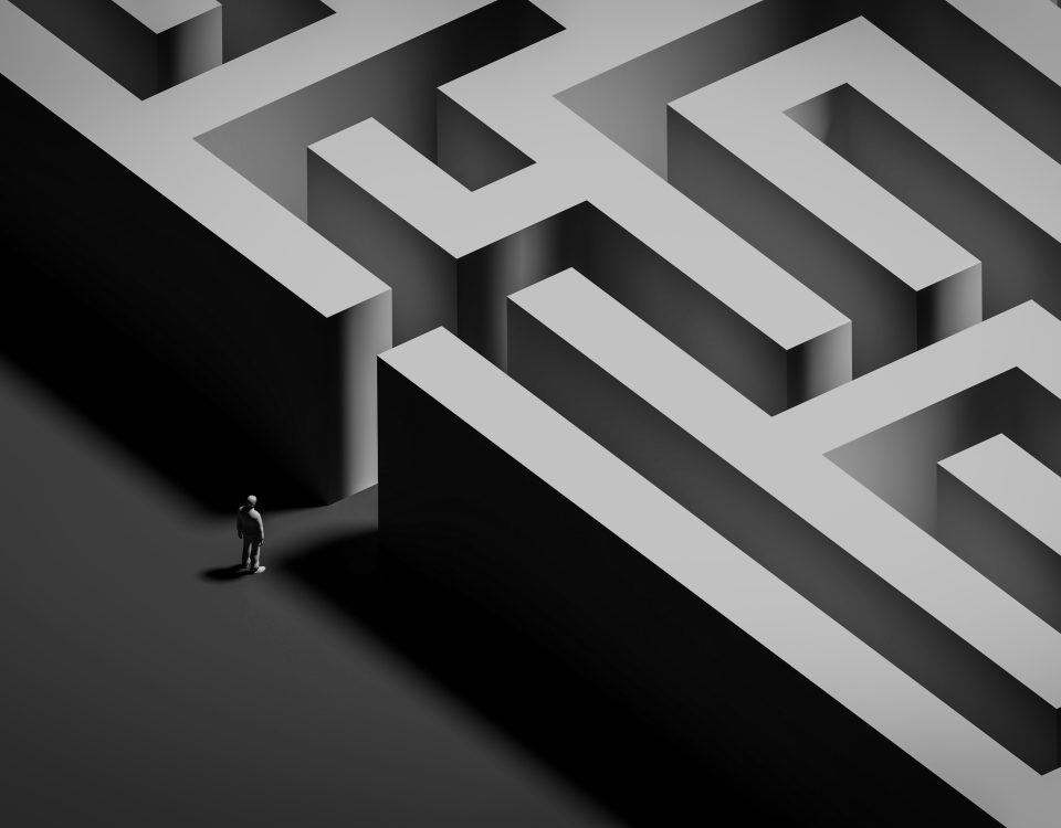A person stands at the entrance to a maze representing the complexity of SOC support when something goes wrong.